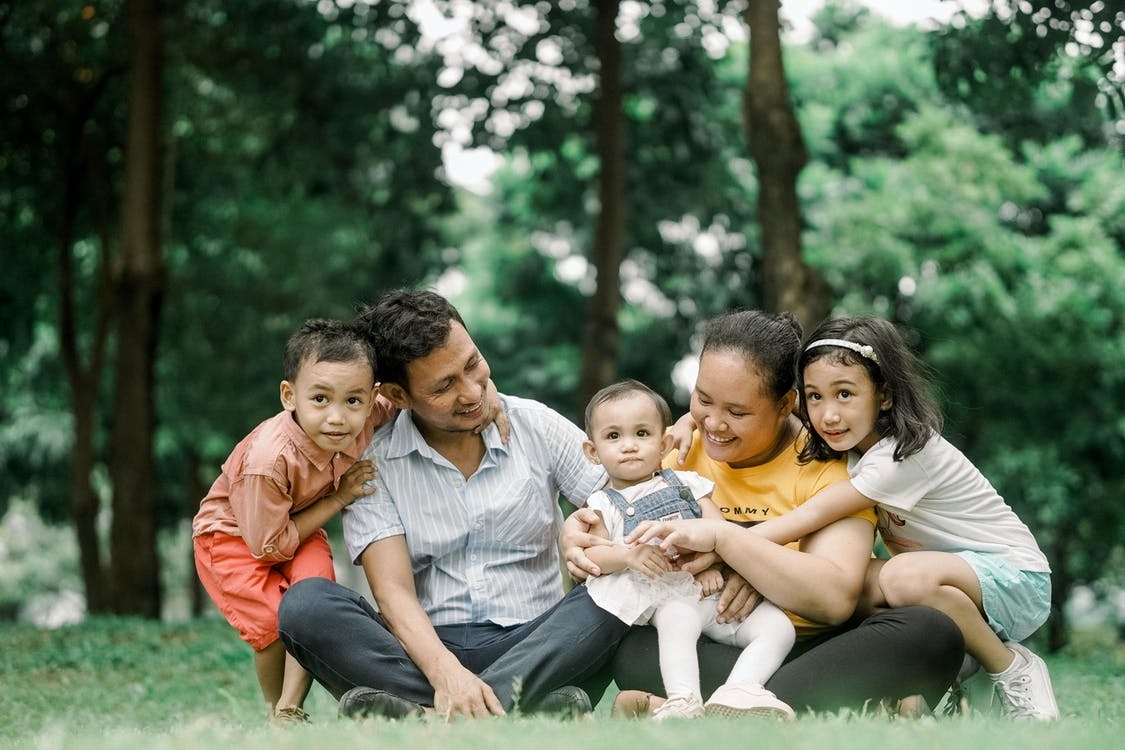 A person relaxing with their family after purchasing life insurance